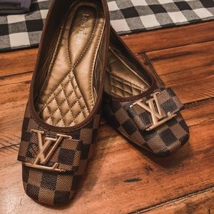 Louis Vuitton baby doll shoes.